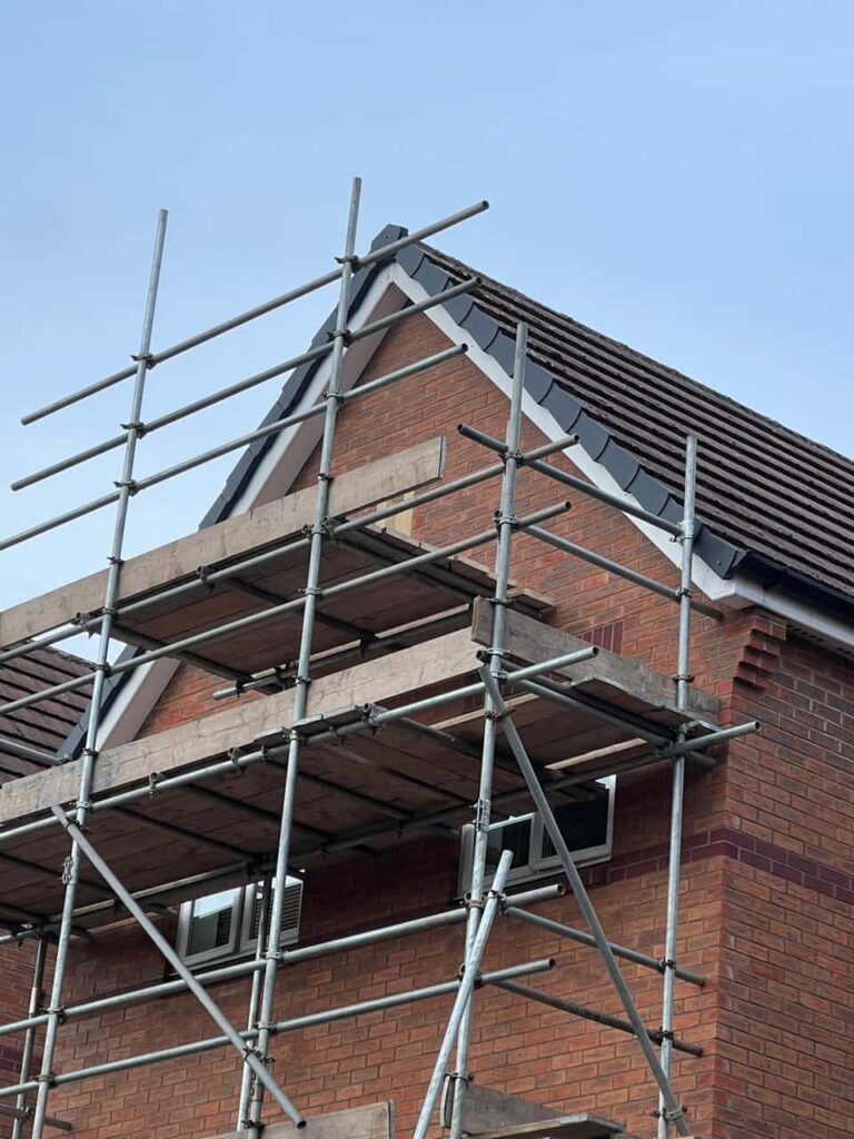 This is a photo of a roof which has just been repaired. There is a scaffold located at the gable end for access onto the roof. Works carried out by MCM Roofing Repairs Gillingham