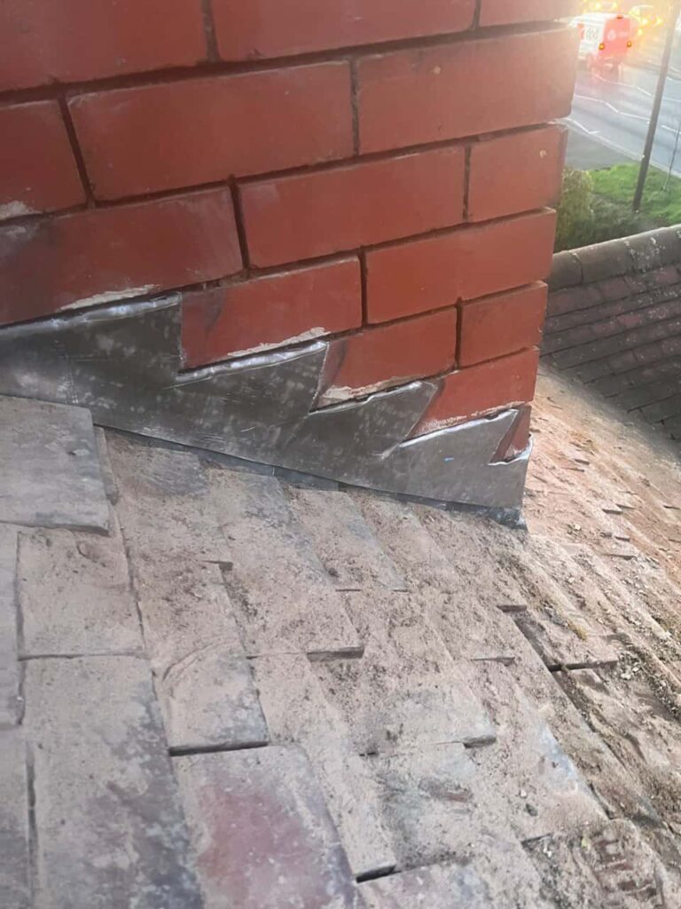 This is a photo of new leadwork being installed around an old chimney. Works carried out by MCM Roofing Repairs Gillingham